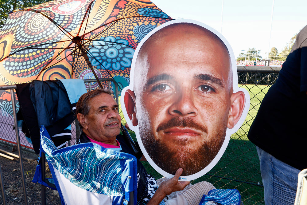 Supporter holding a Sports Head