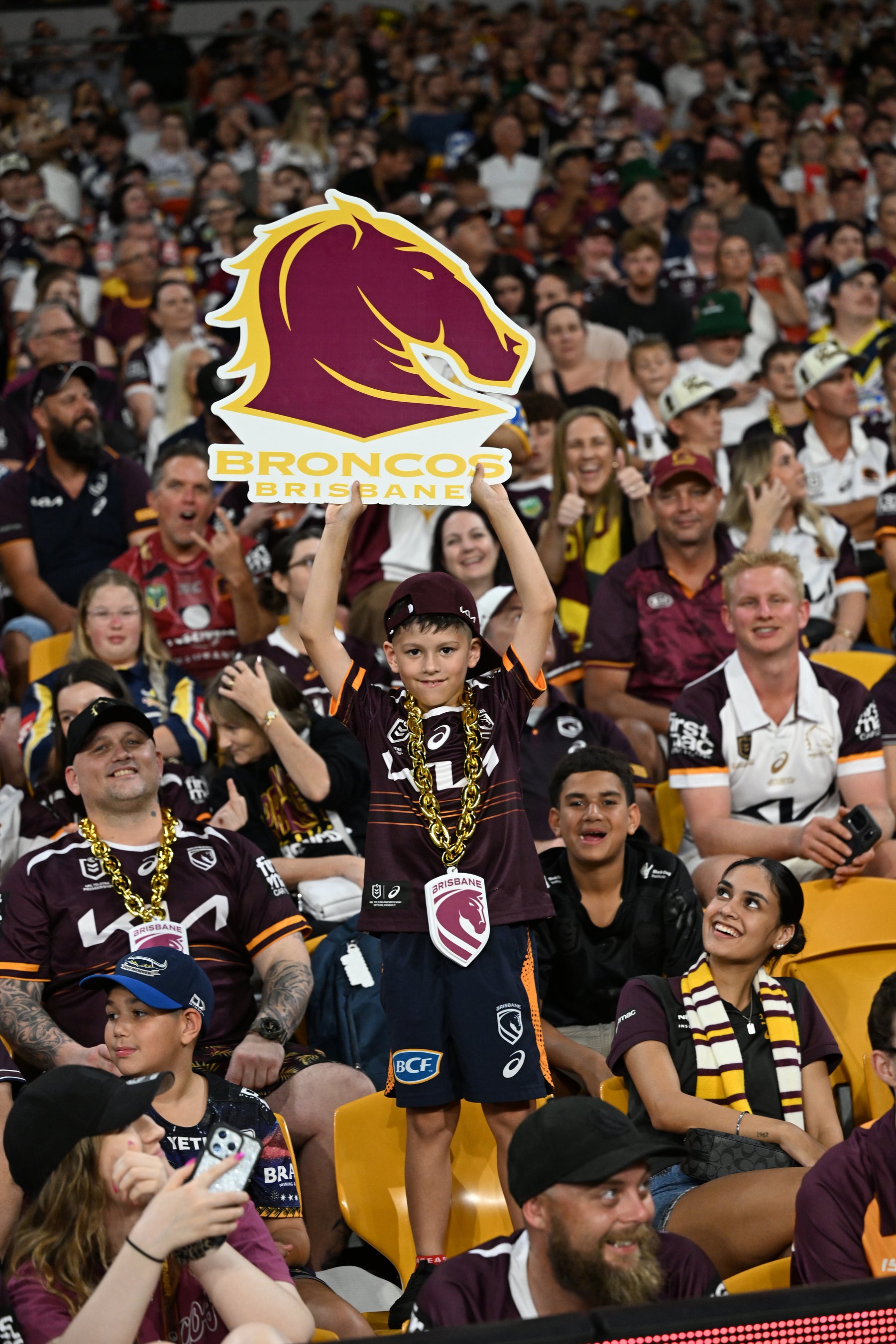 Supporters holding Sports Heads at a live game