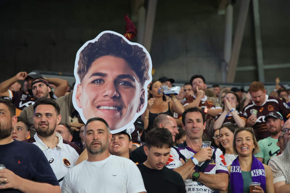 Supporter holding a Sports Head