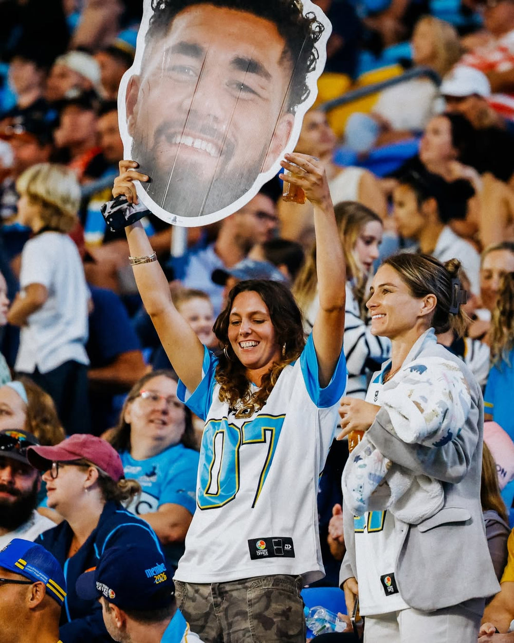 Supporter holding a Sports Head