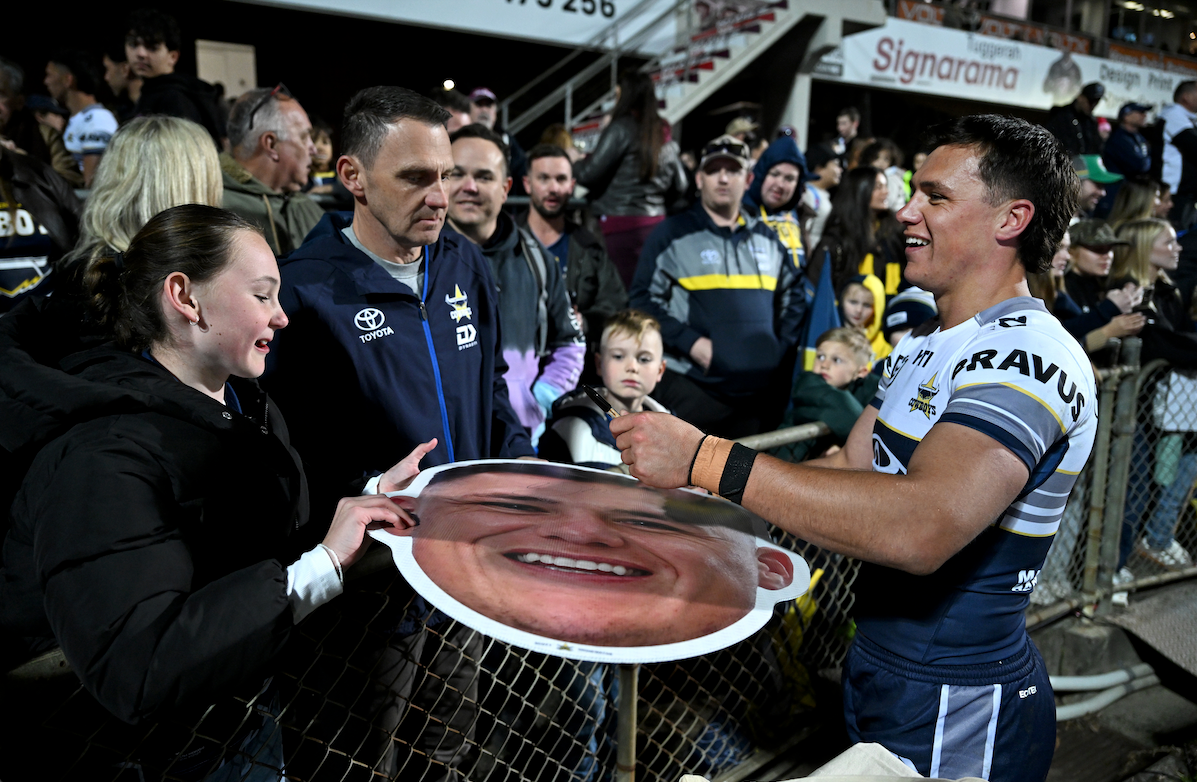 Supporters holding Sports Heads at a live game
