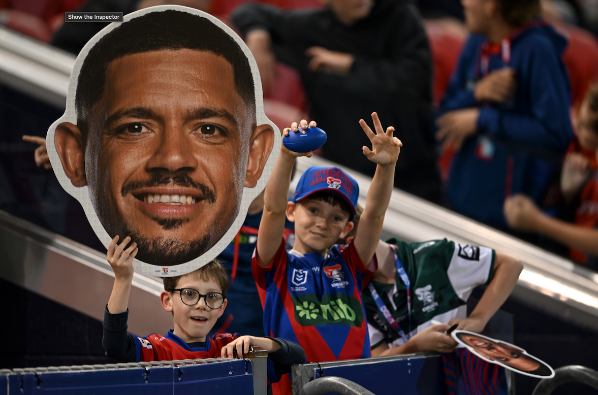 Supporters holding Sports Heads at a live game