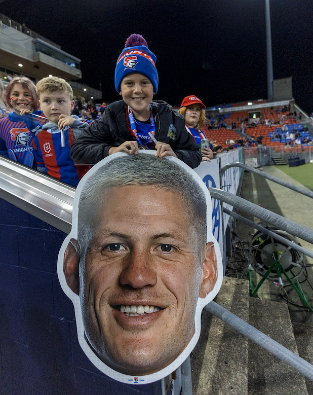Supporter holding a Sports Head