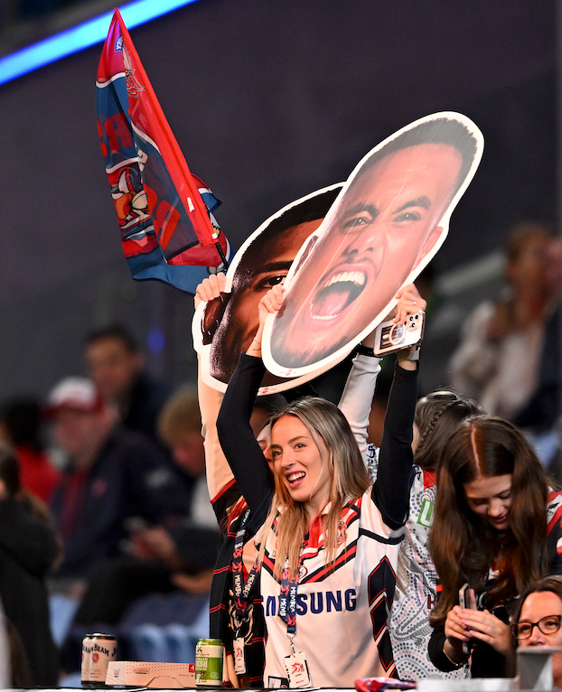 Supporter holding a Sports Head